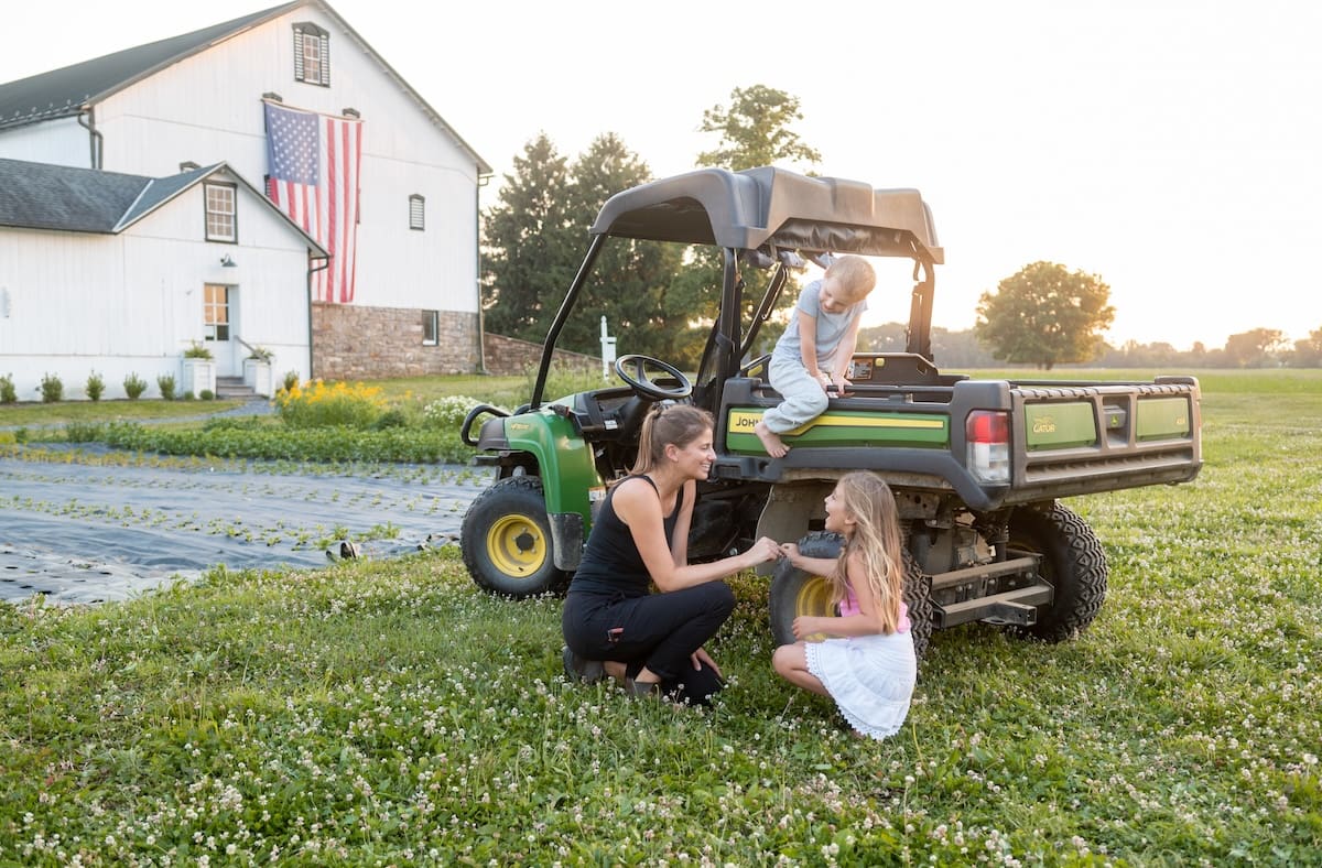 Katy with her children in the flower field at Hidden Springs Flower Farm